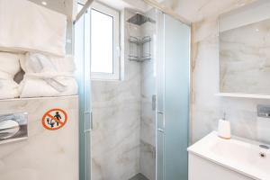 a bathroom with a shower and a sink at Velvet Apartments in Rhodes Town +37 photos