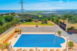 a swimming pool in a villa with a view at Villa Roca Penthouse in Estepona