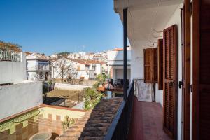 a balcony of a house with a view of a city at Canet Beach 1 in Canet de Mar