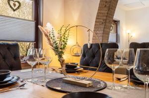 a table with wine glasses on top of it at Fewo Jaeger in Bad Sachsa