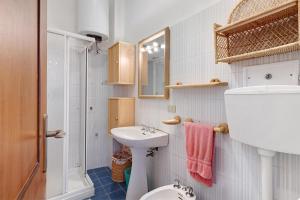 a bathroom with a sink and a toilet and a shower at Bilo Costella in Bonassola