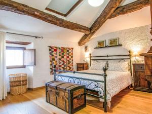 a bedroom with a bed and a wooden floor at Apartment Torre by Interhome in Palazzuolo sul Senio