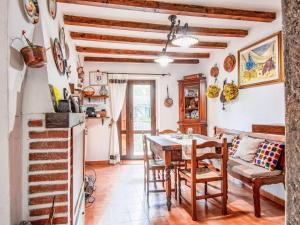 a kitchen and dining room with a table and chairs at Apartment Torre by Interhome in Palazzuolo sul Senio
