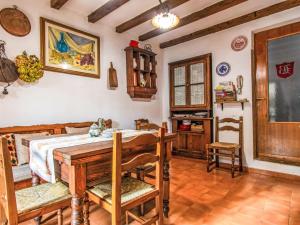 a dining room with a wooden table and chairs at Apartment Torre by Interhome in Palazzuolo sul Senio
