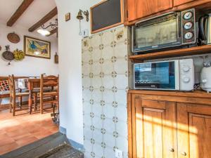 a kitchen with two microwaves on a wall at Apartment Torre by Interhome in Palazzuolo sul Senio +17 photos