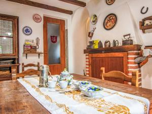 a dining room table with bowls of food on it at Apartment Torre by Interhome in Palazzuolo sul Senio