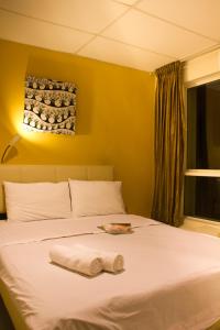 Postel nebo postele na pokoji v ubytování 7 Star Hotel