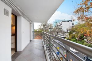 a balcony with a view of a city at Dfm Happy Days E - Funchal in Funchal