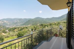 a balcony with a view of mountains at Bed And Breakfast Il Ceppo Wild in Pimonte +26 photos