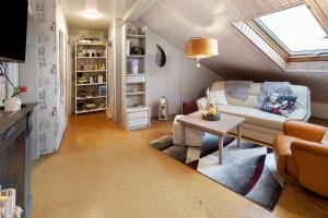 a living room with a couch and a table at Landharmonie Knüll in Frielendorf