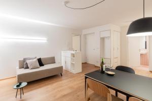 a living room with a couch and a table at Hus Appartement - Nr. 4 in Valdaora