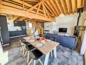 a dining room with a table and chairs at Chalet Alpina by Interhome in Ovronnaz
