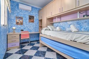 a bedroom with a bed and a desk with a chair at Villa Soraida in Ítrabo +32 photos
