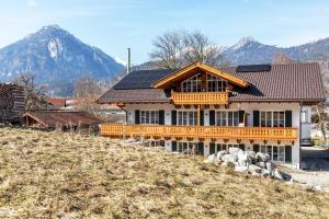 a house with solar panels on top of a hill at Beim Klarwein in Farchant