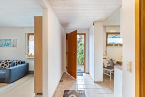 a room with white walls and a blue couch at Ferienwohnung Brigitte in Forbach