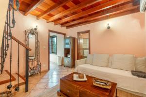 a living room with a couch and a table at Gran Drago in Valverde