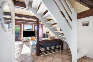 an office with a desk under a stairs at Arosa in Bachenbrock