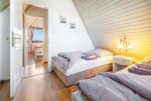 a bedroom with two beds in a room at Arosa in Bachenbrock