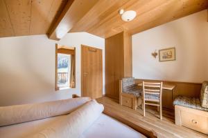 a living room with a couch and a table at Sonnleiten der kleinen Bären 9 in Collepietra +31 photos