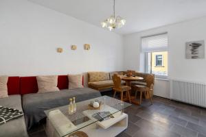 a living room with a couch and a table at Haus Berlin Annaberg in Annaberg-Buchholz