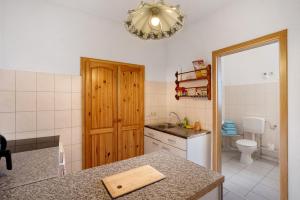 a kitchen with a sink and a counter top at Haus Berlin Annaberg in Annaberg-Buchholz +16 photos
