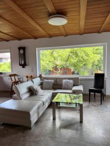 a living room with a couch and a table at Casa Jo und Jo in Pfullendorf