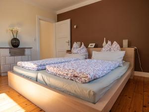 a bedroom with two beds with pillows on them at altes forsthaus schotten in Schotten