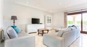 a living room with two couches and a tv at Ca Nostra in Son Servera