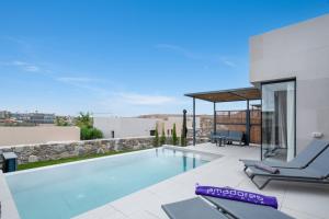 a villa with a swimming pool on a roof at Yucas Villa 14 in San Bartolomé