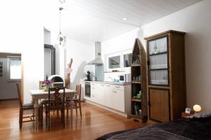 a kitchen and dining room with a table and chairs at Gästehäusle Haag in Waldshut-Tiengen