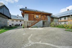 a house with a driveway in front of it at La Grange Villard in Albiez-Montrond