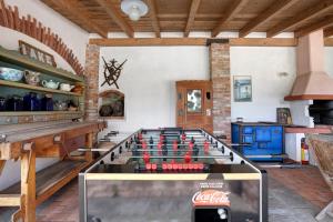 a large glass foosball table in a room at La Vigna - Tra 5 terre e Versilia in Sarzana
