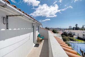 a balcony with a view of a building at Ocean City View Loft in Ponta Delgada