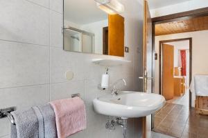 a bathroom with a sink and a mirror at Haus Prossliner in Tesimo +22 photos