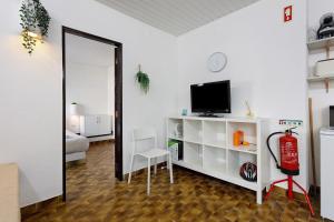 a living room with a mirror and a fire extinguisher at Oasis de Ferrel in Ferrel