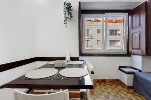 a dining room with a table and a window at Oasis de Ferrel in Ferrel +20 photos