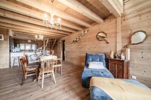 a room with a table and a dining room at Le Chat Perché in Bernex