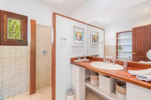 a bathroom with a sink and a shower at Casa del Puerto in Port de Soller +27 photos