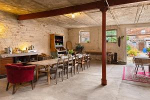 a dining room with a wooden table and chairs at Gästehaus Schlamau19 in Schlamau