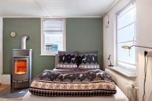 a bedroom with a bed and a fire place at Ferienwohnung Donauherz in Stetten