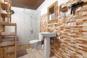 a bathroom with a sink and a toilet at Hogar vacacional Maya in Santa Maria de Guia de Gran Canaria +13 photos