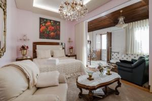 a bedroom with a bed and a living room at W430 Guimarães in Guimarães