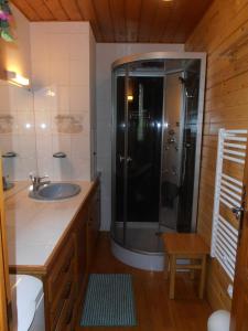 a bathroom with a shower and a sink at Chalet St Victoire - Les Orres in Les Orres +15 photos