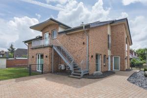 a brick building with a spiral staircase on it at Ferienhaus Manni Eg in Büsum