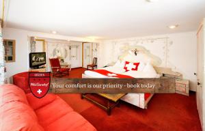 A bed or beds in a room at Hotel Walliserhof - The Dom Collection