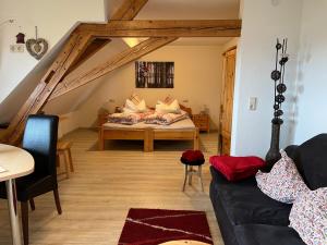 a living room with a couch and a attic at Haus Jehle in Görwihl