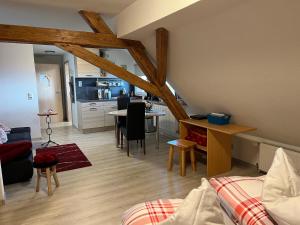 a living room with a kitchen and a dining room at Haus Jehle in Görwihl