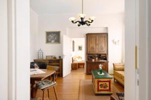a living room with a couch and a table at Ferienwohnung Abtei Klosterhof in Maring-Noviand +17 photos
