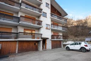 a white car parked in front of a building at Casa Gianpaolo in Piode