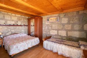 a bedroom with two beds and a wooden ceiling at El cazador 2 in Granadilla de Abona +17 photos